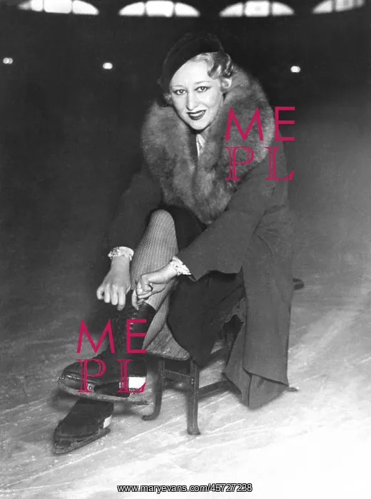  : Woman putting on her ice skates