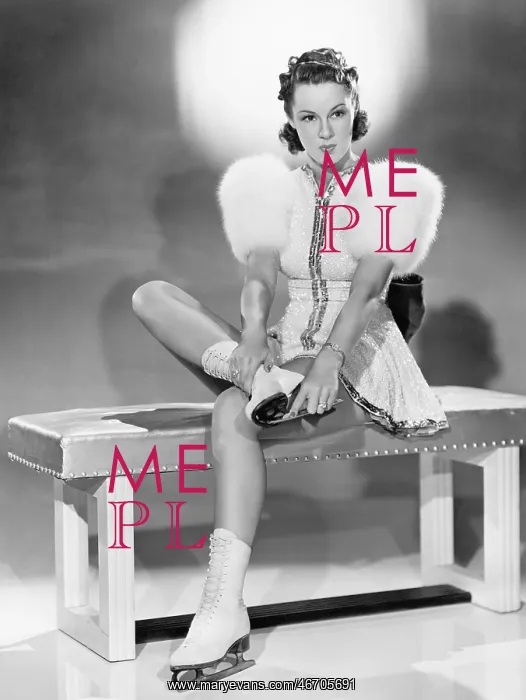  : Woman putting on ice skates