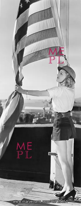  : Woman raising American flag