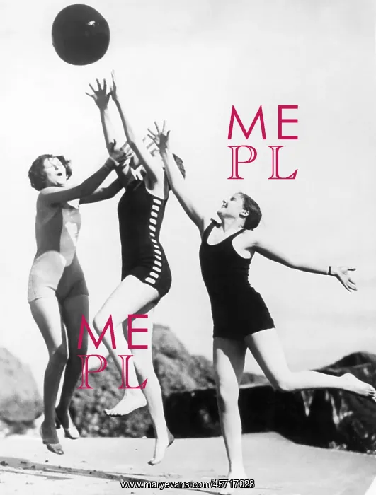 : Three woman reaching for beach ball : Three woman reaching for beach ball
