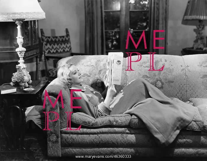 : Woman reading on couch : Woman reading on couch