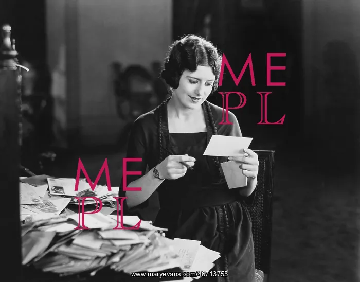 : Woman reading letter with pile of mail : Woman reading letter with pile of mail