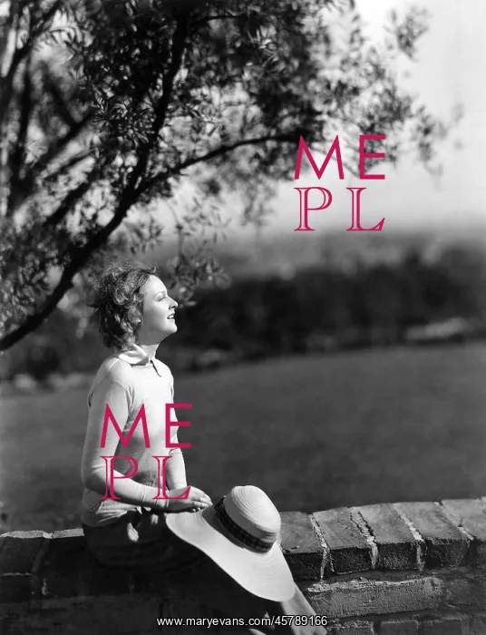 : Woman resting against wall : Woman resting against wall