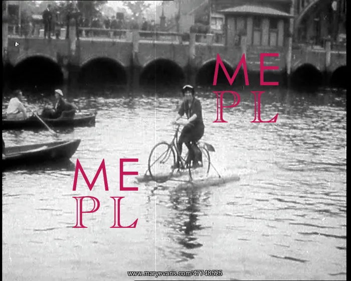 : Woman Riding Along A River on a Floating Bicycle : Woman Riding Along A River on a Floating Bicycle