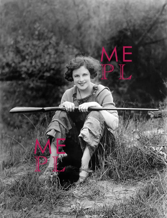  : Woman with rifle