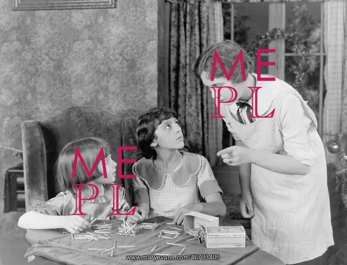 : Woman scolding her two daughters for playing with : Woman scolding her two daughters for playing with