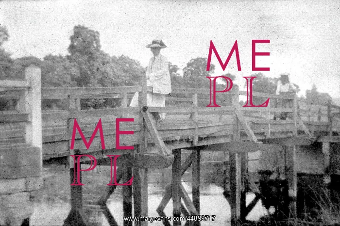  : Woman seated on bridge