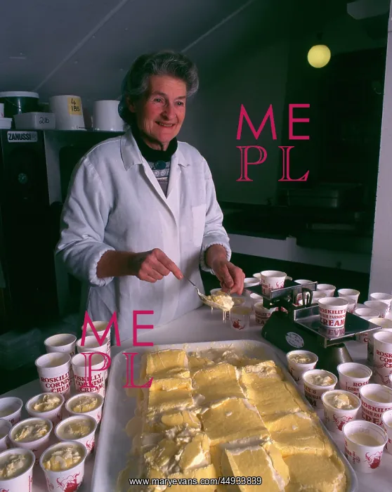 : Woman serving Roskilly's Cornish Clotted Cream : Woman serving Roskilly's Cornish Clotted Cream