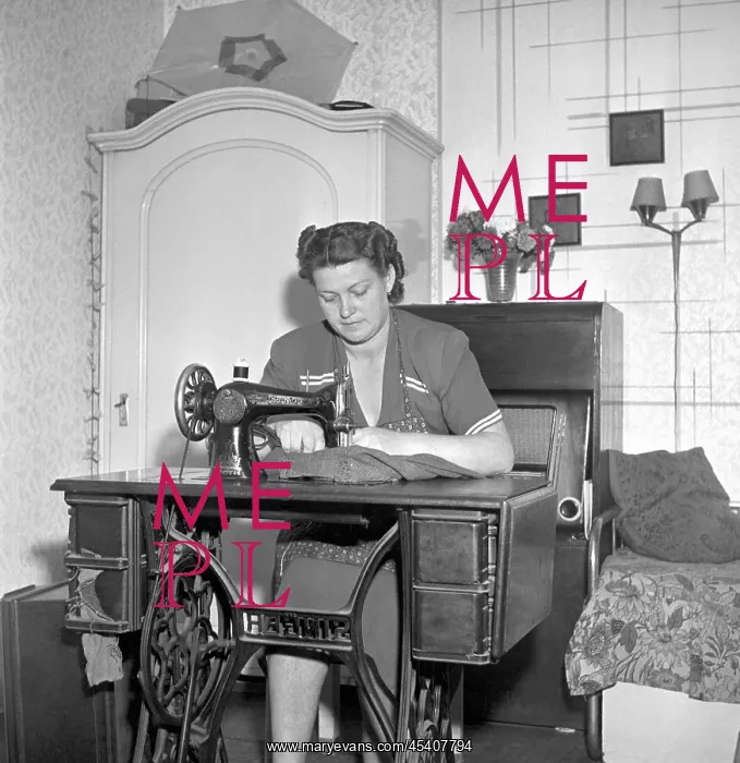 : Woman sewing : Woman sewing
