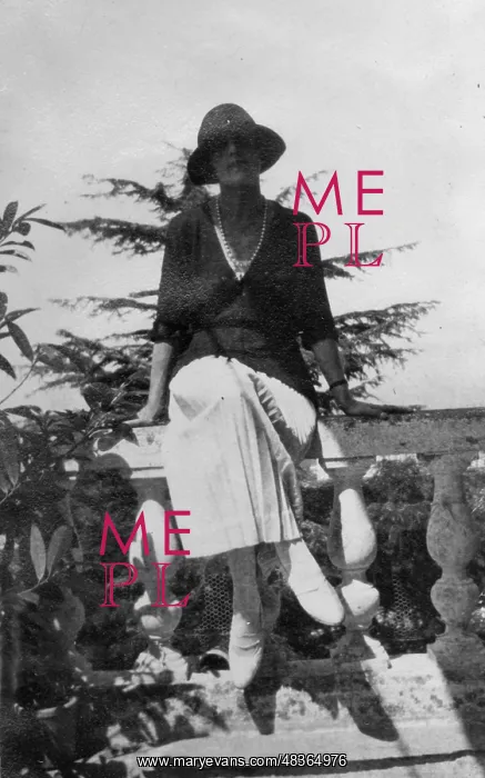  : Woman sits on balustrade