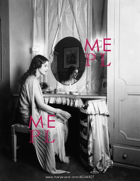 : Woman sitting at dressing table : Woman sitting at dressing table