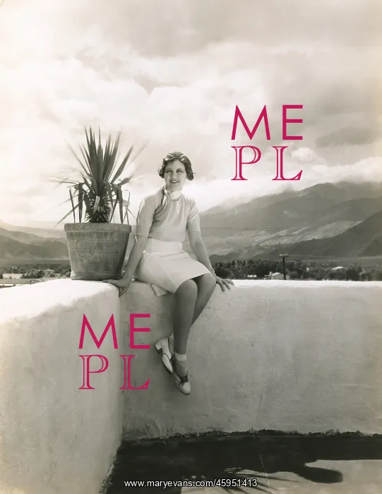 : Woman sitting on outdoor ledge : Woman sitting on outdoor ledge