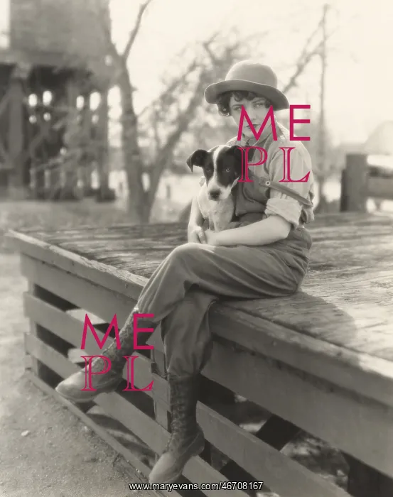 : Woman sitting outdoors with her dog : Woman sitting outdoors with her dog