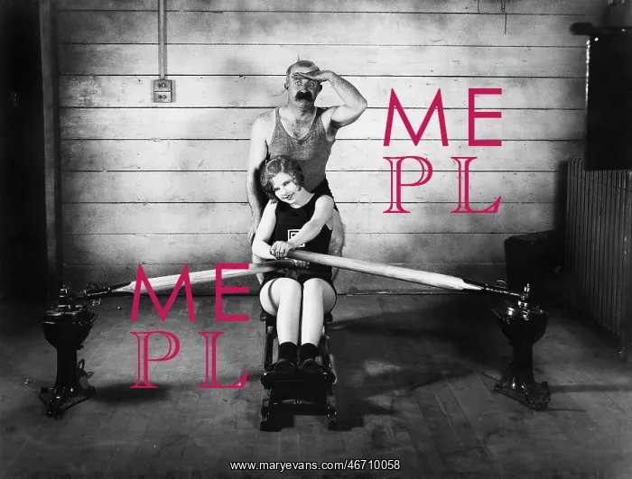  : Woman sitting on a rowing machine with a man behind her