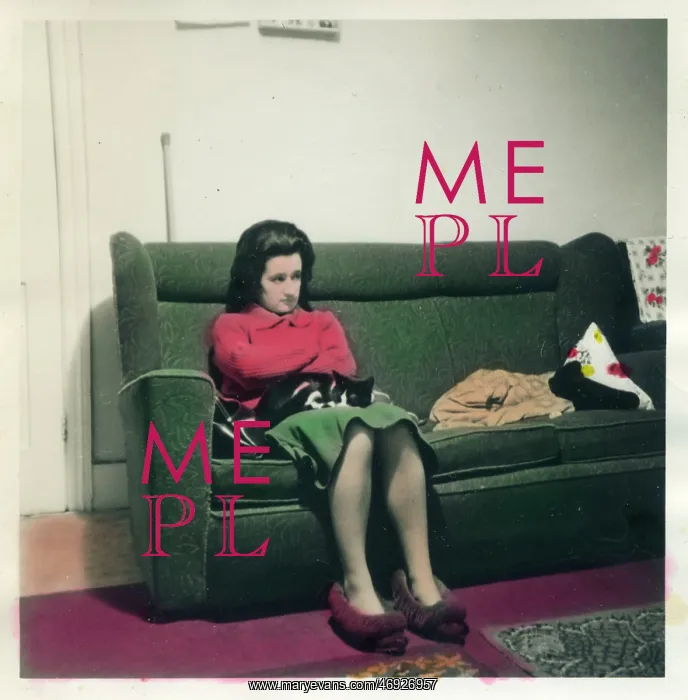 : Woman in slippers seated on sofa : Woman in slippers seated on sofa