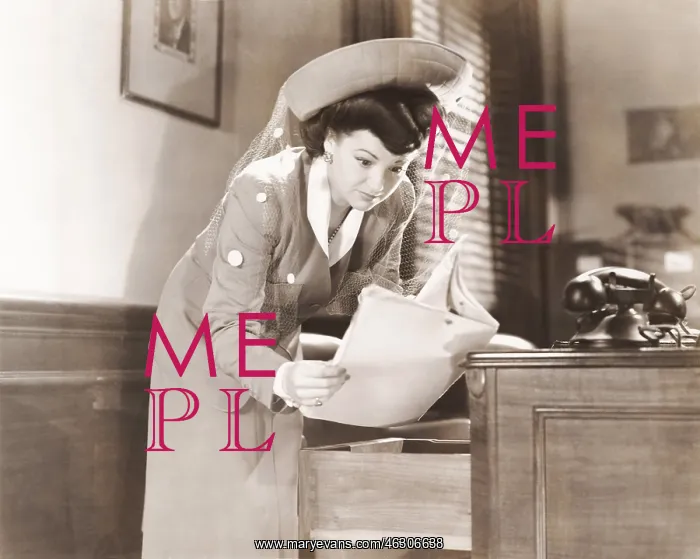 : Woman sneaking a look at documents in office : Woman sneaking a look at documents in office