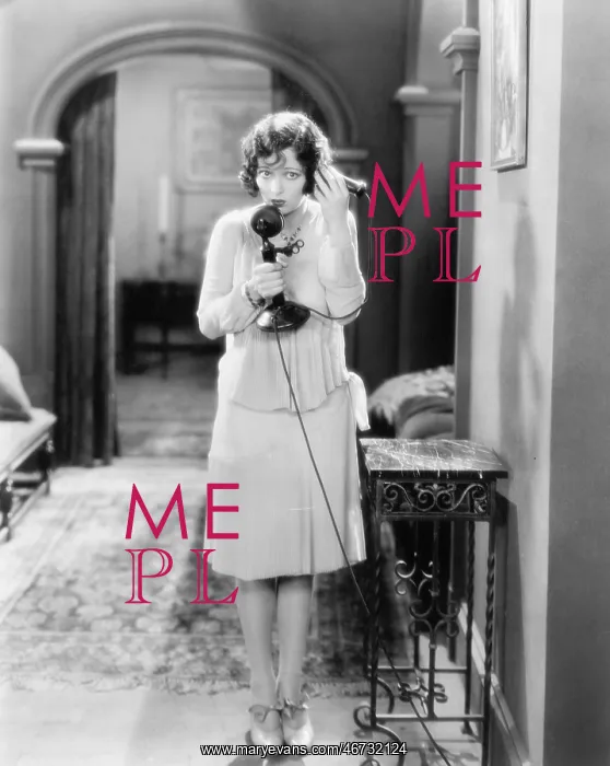 : Woman standing in the hallway talking on a candlestick : Woman standing in the hallway talking on a candlestick