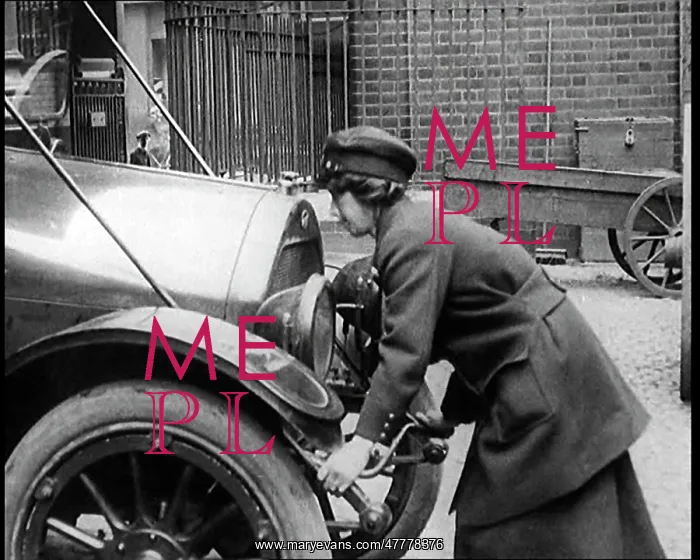 : Woman Starting A Motorcar With A Crank Handle : Woman Starting A Motorcar With A Crank Handle