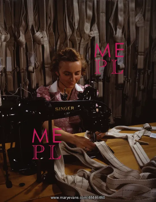 : Woman stitching parachute harnesses during : Woman stitching parachute harnesses during