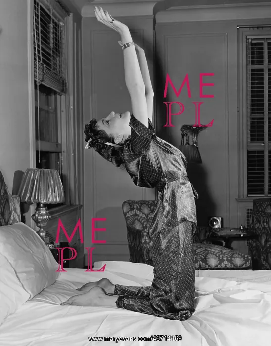 : Woman stretching on bed : Woman stretching on bed