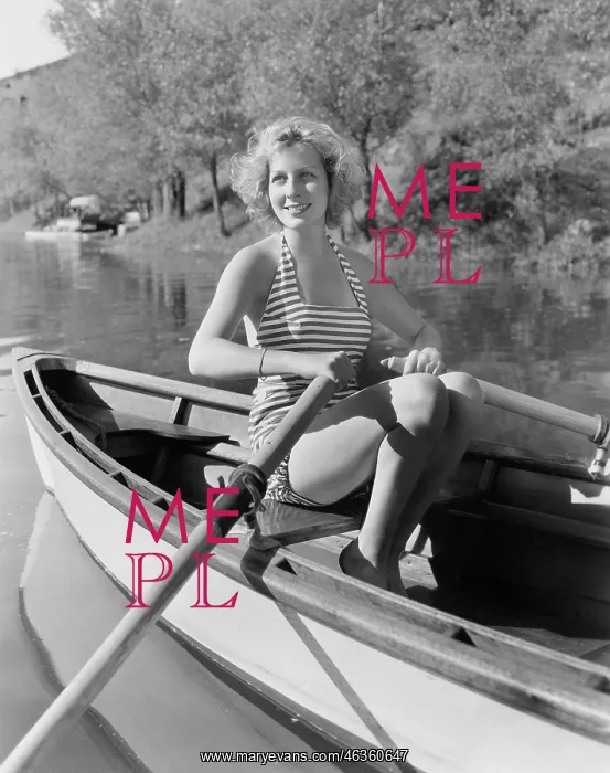: Woman in a striped bathing suit rowing : Woman in a striped bathing suit rowing