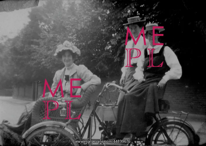 : Woman and students on motorised bicycle : Woman and students on motorised bicycle