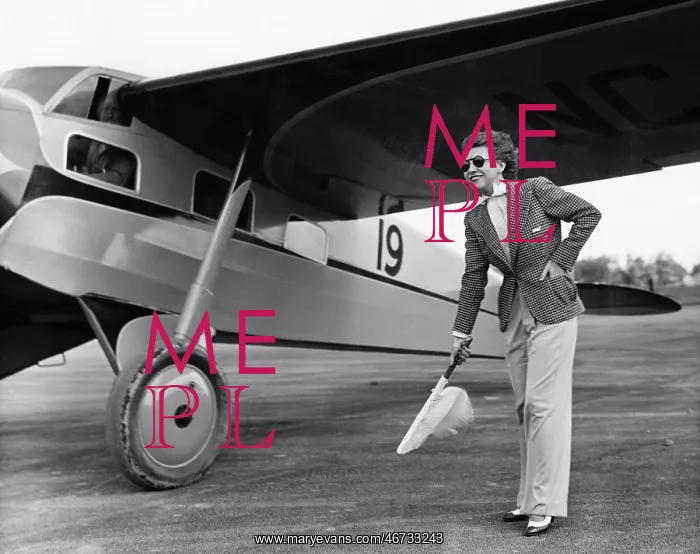 : Woman in suit with plane : Woman in suit with plane