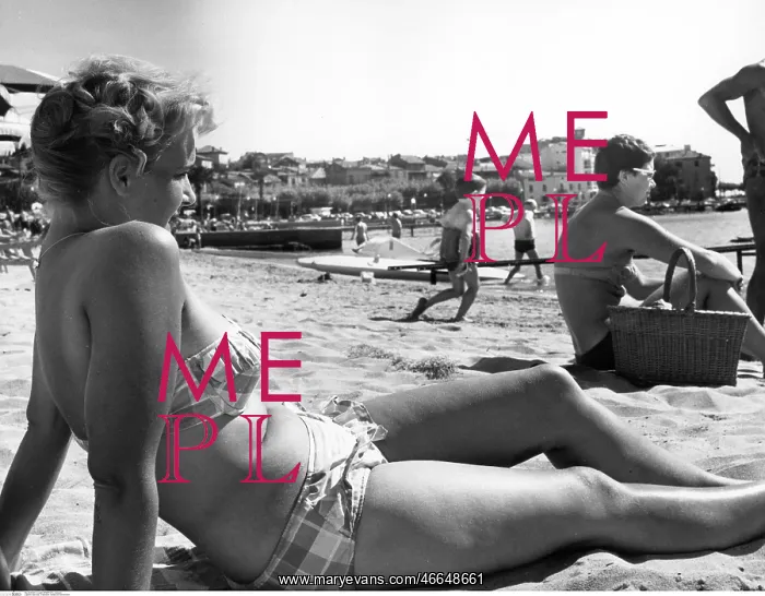  : Woman sunbathing on a beach