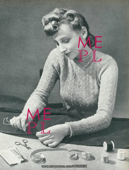 : Woman tacking a hem before stitching it