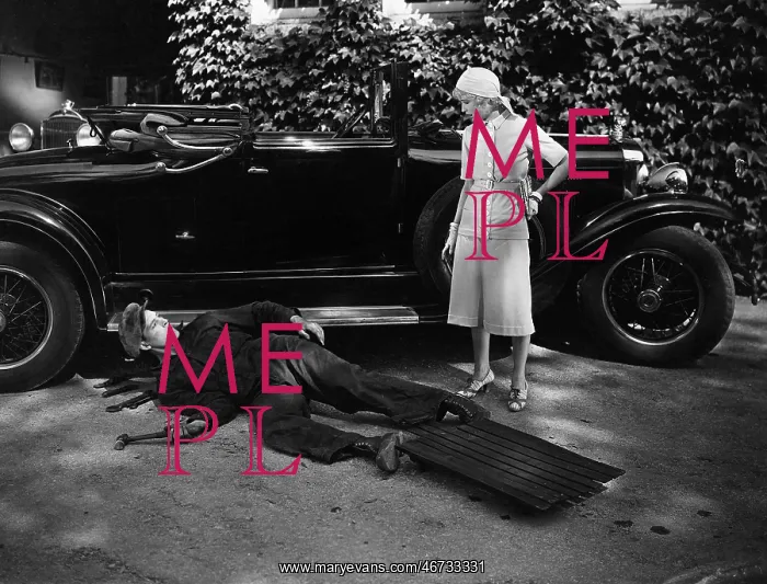 : Woman talking to man working on car : Woman talking to man working on car