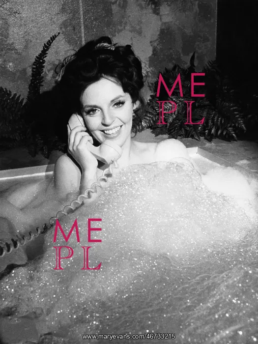  : Woman talking on phone in bubble bath