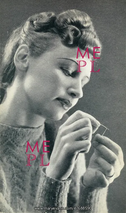  : Woman threading a needle