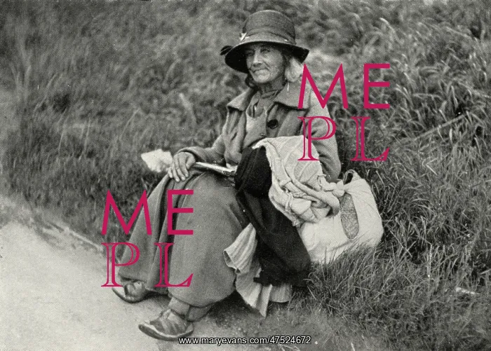 : Woman tramp sitting at side of road : Woman tramp sitting at side of road