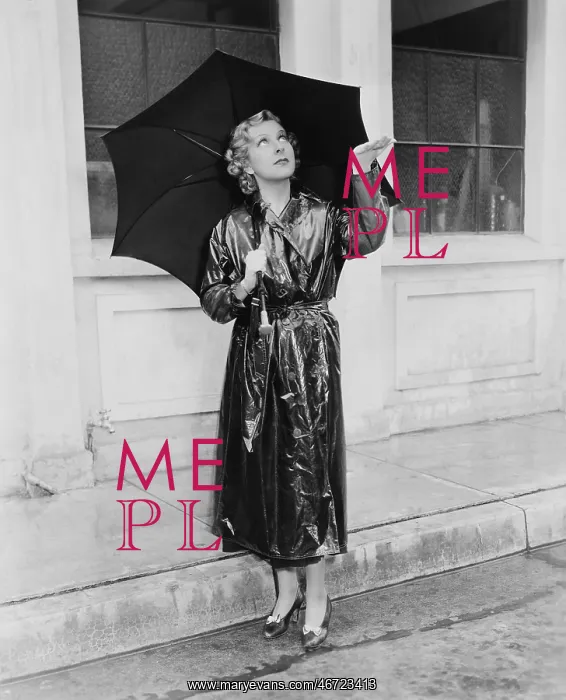 : Woman with umbrella testing for rain : Woman with umbrella testing for rain