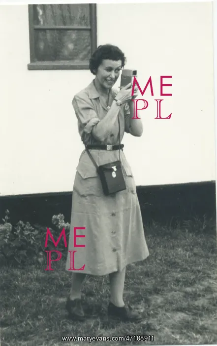 : Woman using a cine camera : Woman using a cine camera