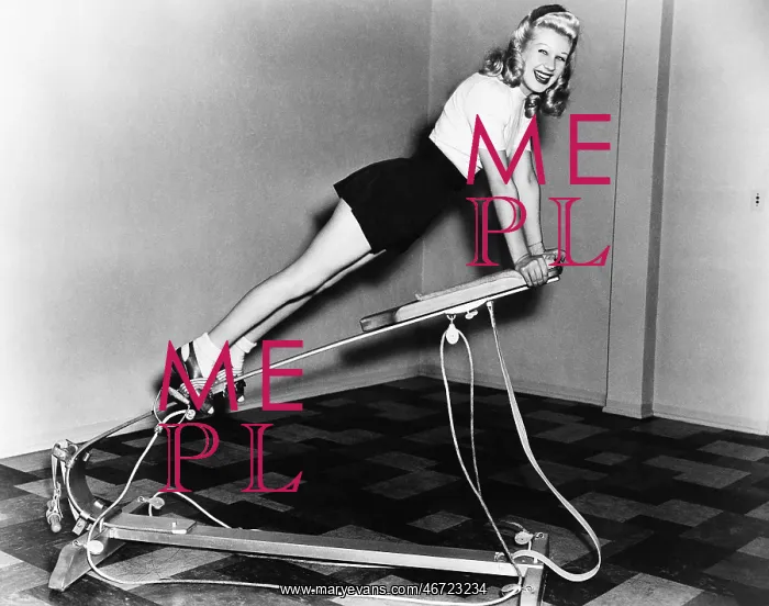 : Woman using exercise equipment : Woman using exercise equipment