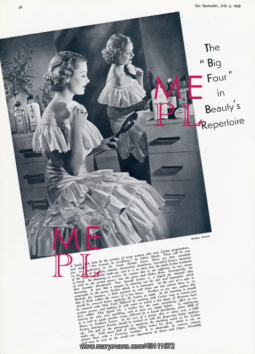 : Woman using a powder puff at her dressing table 1935 : Woman using a powder puff at her dressing table 1935