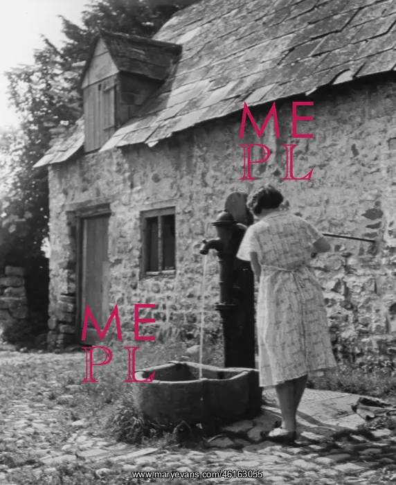 : Woman using water pump : Woman using water pump