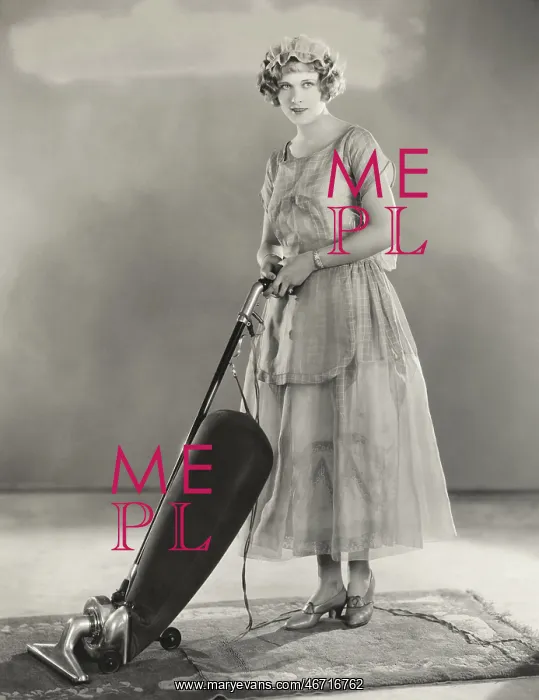  : Woman vacuuming rug