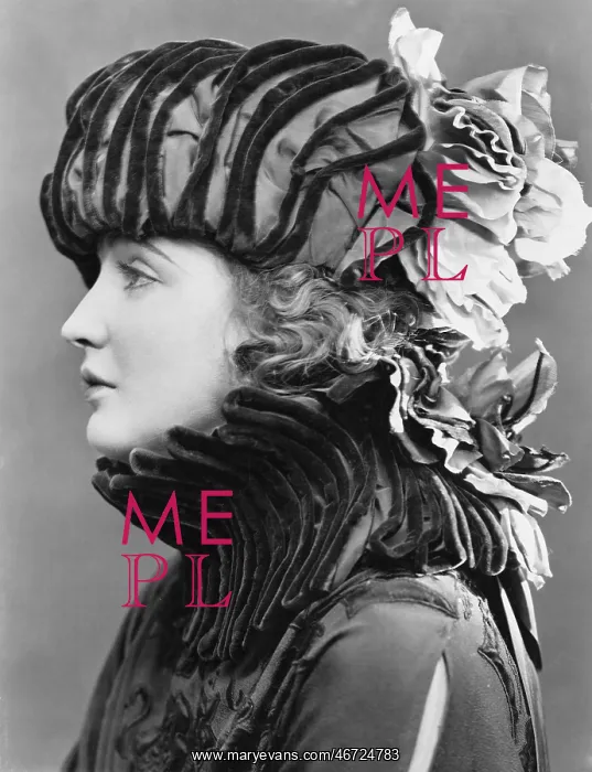 : Woman wearing elaborate hat : Woman wearing elaborate hat