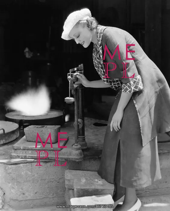  : Woman weighing silver outside foundry