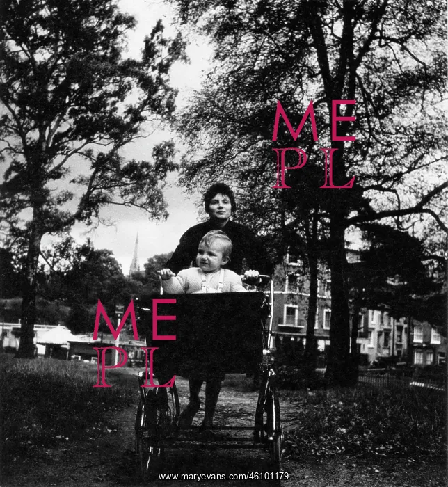  : Woman wheeling a baby in a pram