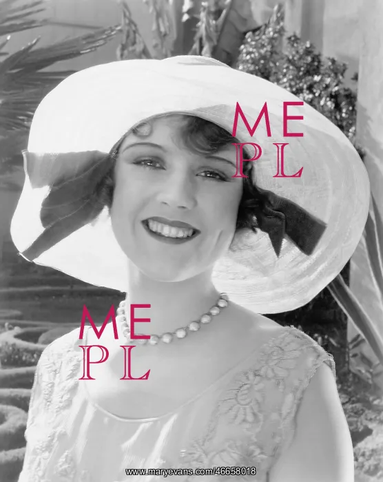 : Woman in a wide brimmed hat smiling : Woman in a wide brimmed hat smiling