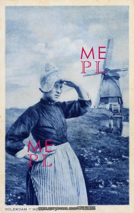 : Woman and windmill, Volendam, Netherlands : Woman and windmill, Volendam, Netherlands