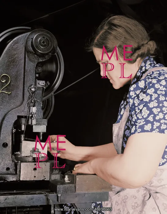 : Woman worker punching holes in electrical : Woman worker punching holes in electrical