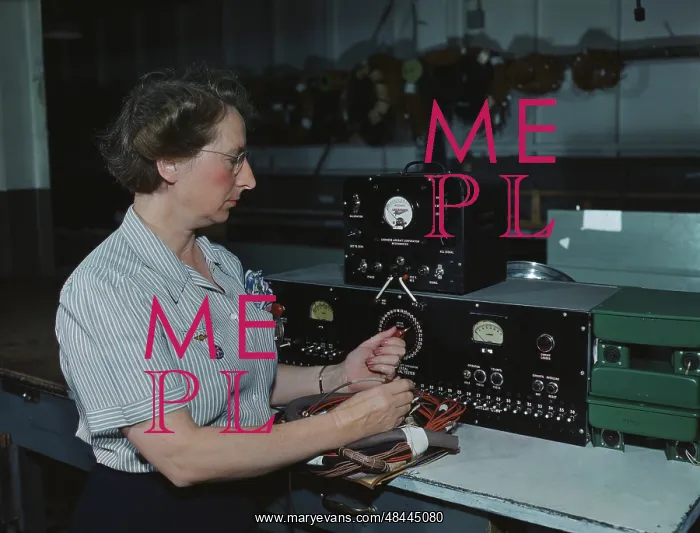 : Woman working with the electric wiring at : Woman working with the electric wiring at