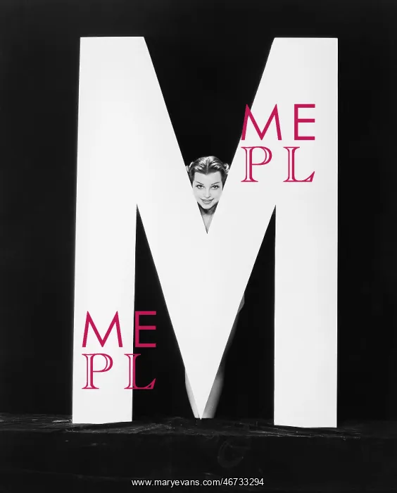  : Womans face with huge letter M