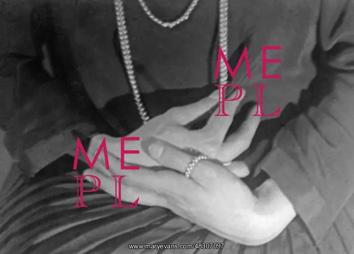 : Woman's hands with a pearl necklace : Woman's hands with a pearl necklace