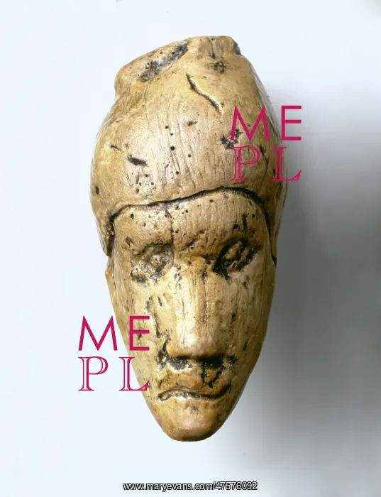 : Woman's head carved in mammoth ivory : Woman's head carved in mammoth ivory