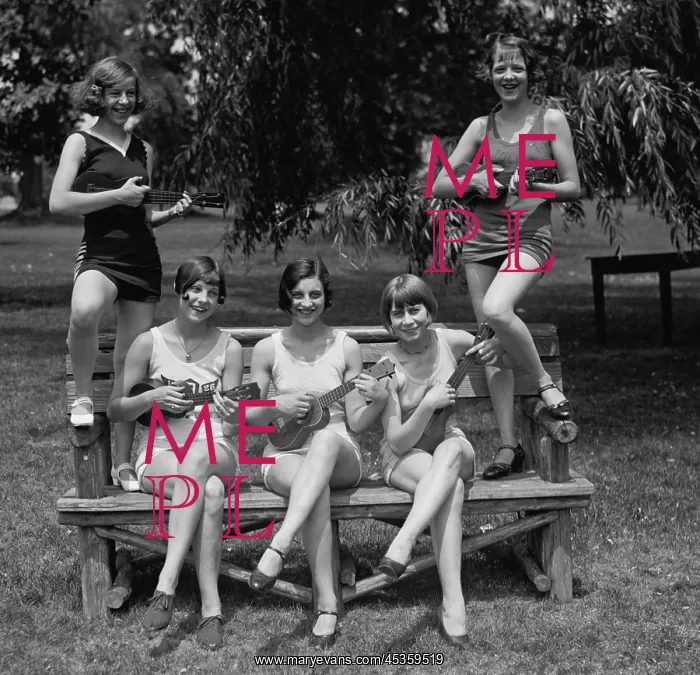 : Women in bathing suits pose playing ukuleles. Washington : Women in bathing suits pose playing ukuleles. Washington